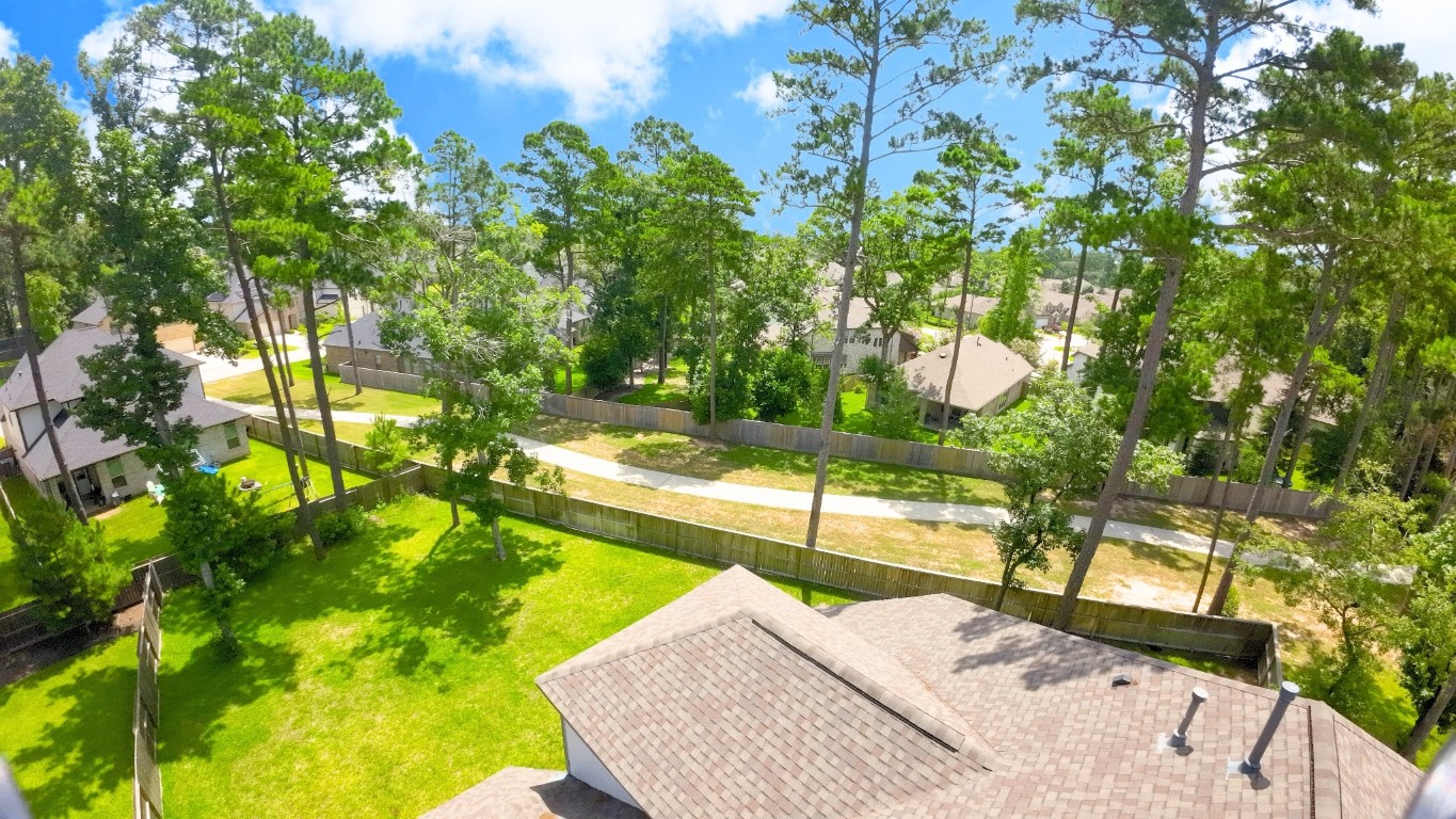 148 Gray Pne Grove Conroe, TX 77318 - Photo 43 of 46 a view of yard from a tub