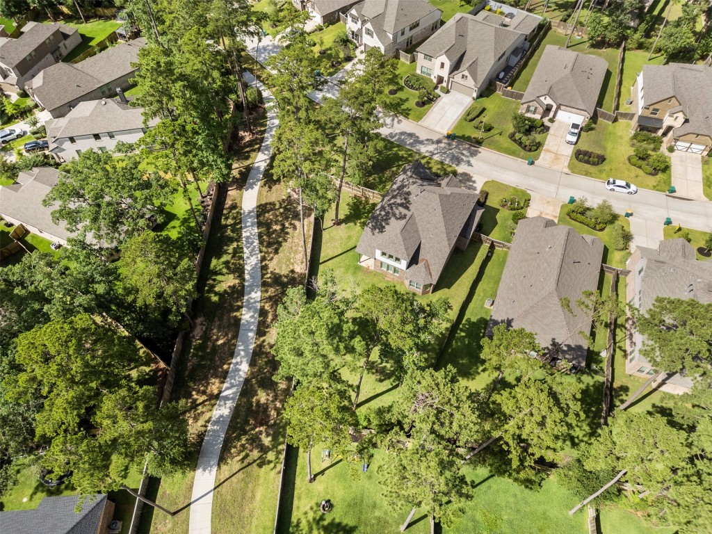 148 Gray Pne Grove Conroe, TX 77318 - Photo 5 of 46 an aerial view of a residential houses with yard