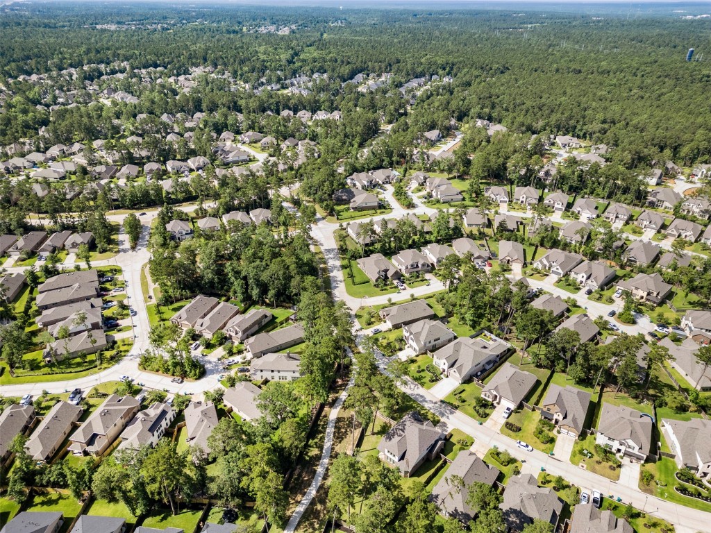 148 Gray Pne Grove Conroe, TX 77318 - Photo 7 of 46 an aerial view of residential houses with outdoor space and trees