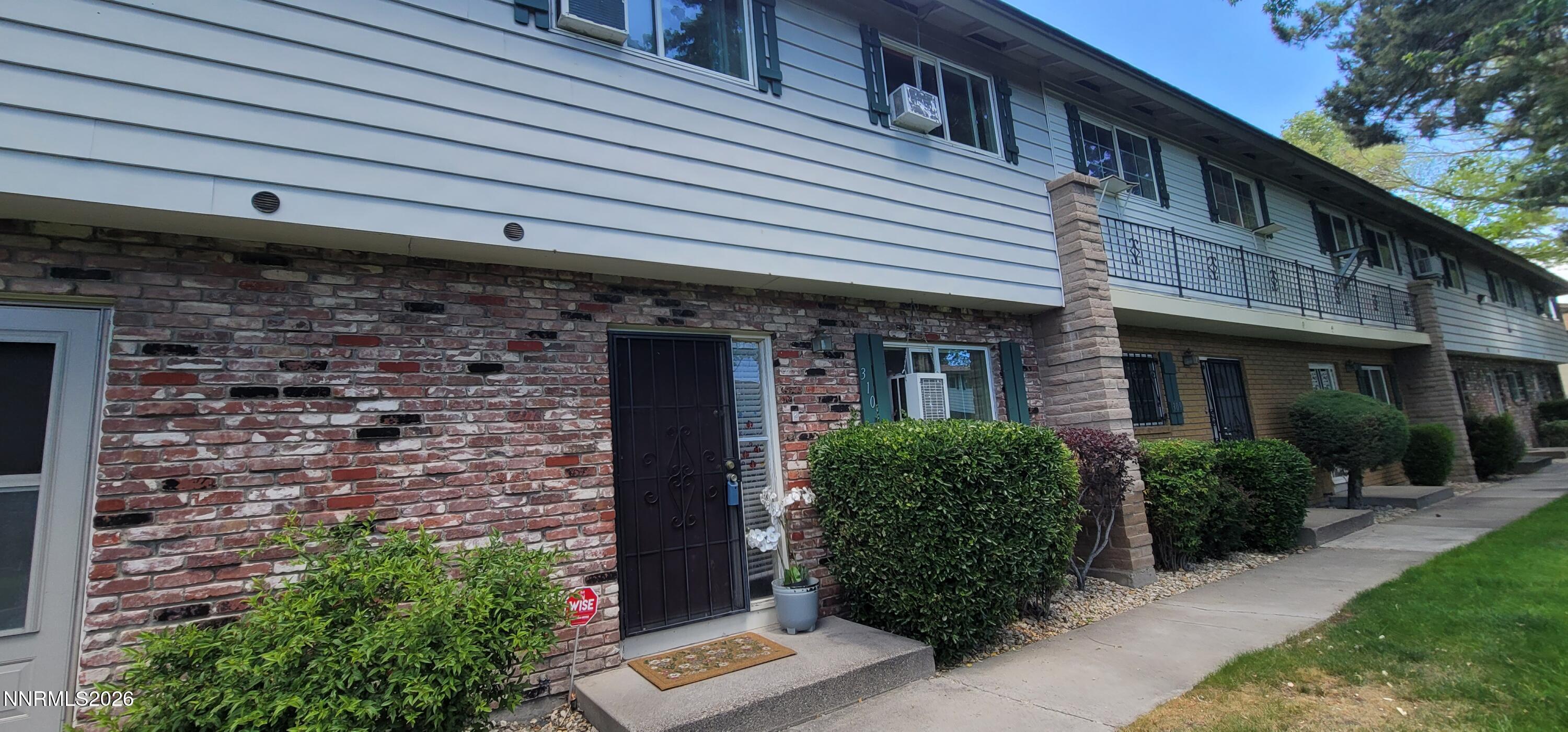 310 Smithridge Park Reno, NV 89502 - Photo 1 of 2 a front view of a house with garden