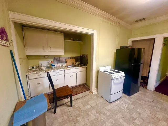 a bed room with a bed and furniture