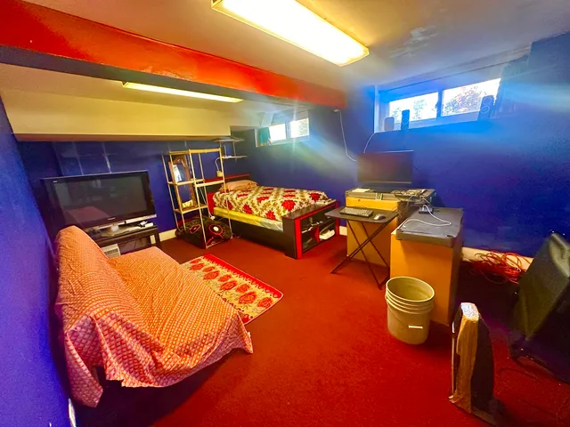 a bed room with a bed and a chair