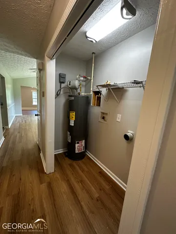 a view of hallway with wooden floor