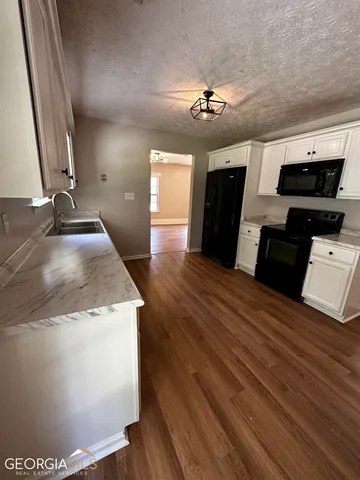a view of a kitchen with a sink