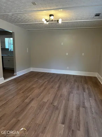 a view of a livingroom with wooden floor