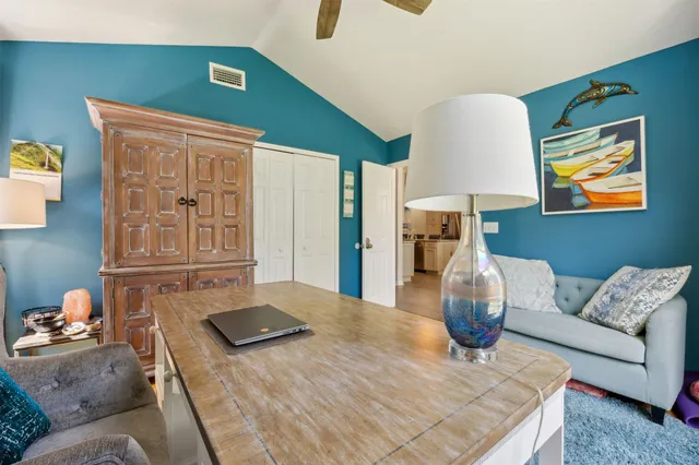 a room with furniture and a book shelf