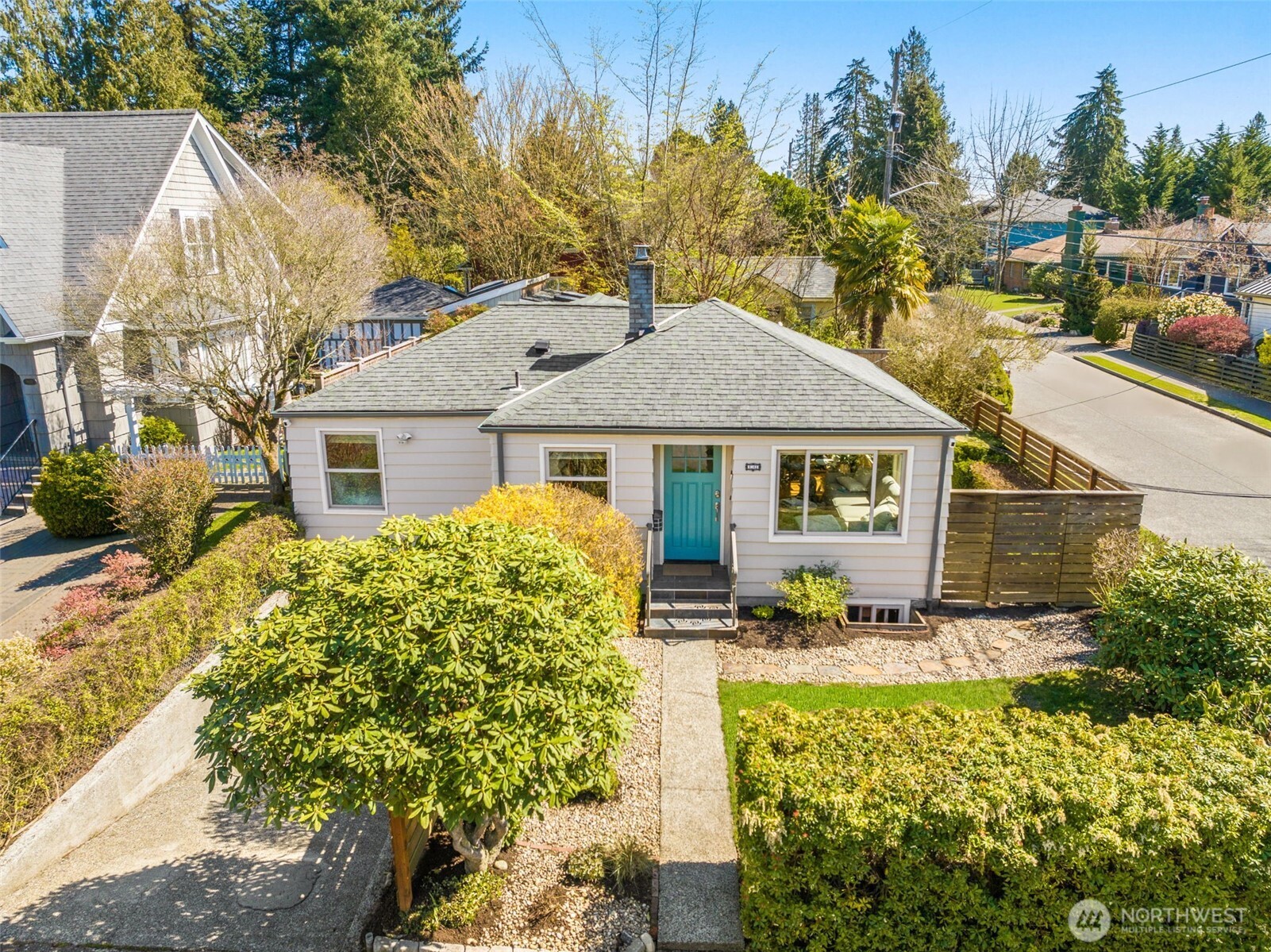 9102 12th Avenue Northeast Seattle, WA 98115 - Photo 1 of 33 a front view of a house with a yard
