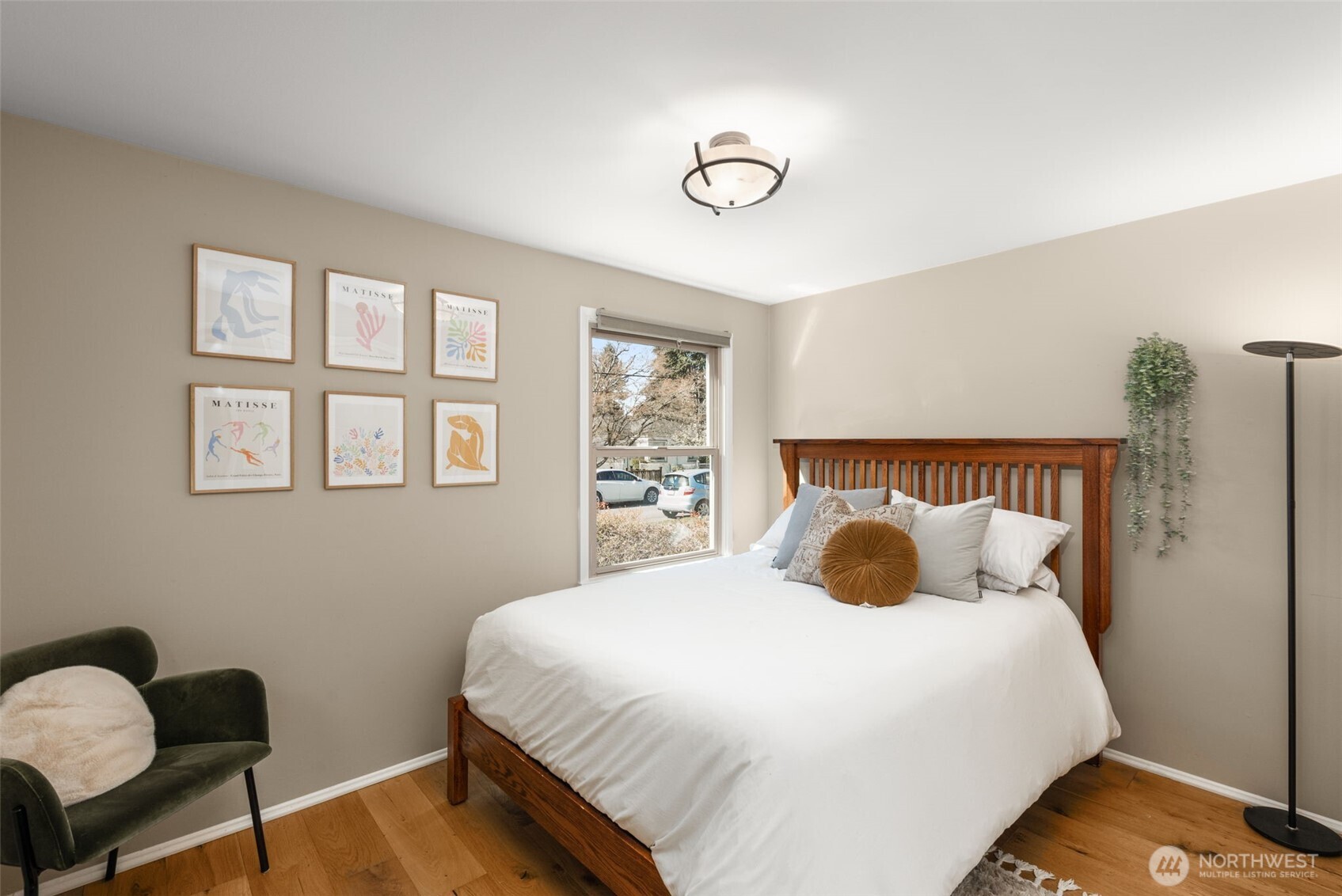 9102 12th Avenue Northeast Seattle, WA 98115 - Photo 14 of 33 a bedroom with a bed and wooden floor