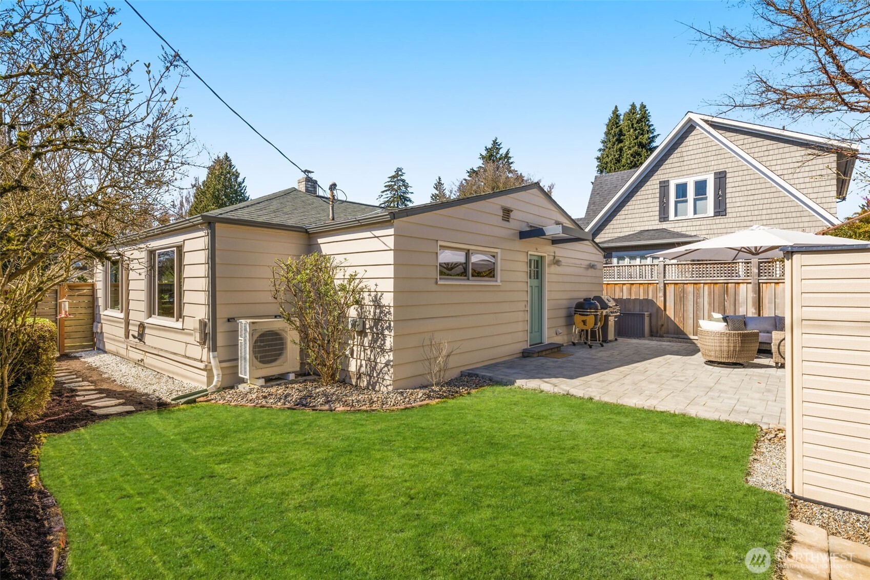 9102 12th Avenue Northeast Seattle, WA 98115 - Photo 24 of 33 a view of a house with a yard and sitting area