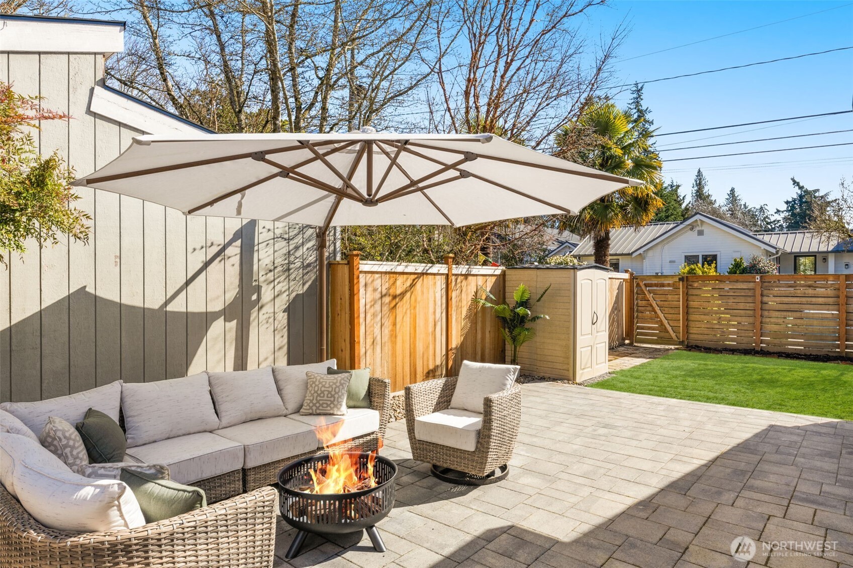 9102 12th Avenue Northeast Seattle, WA 98115 - Photo 25 of 33 a view of a patio with couches and a fire pit