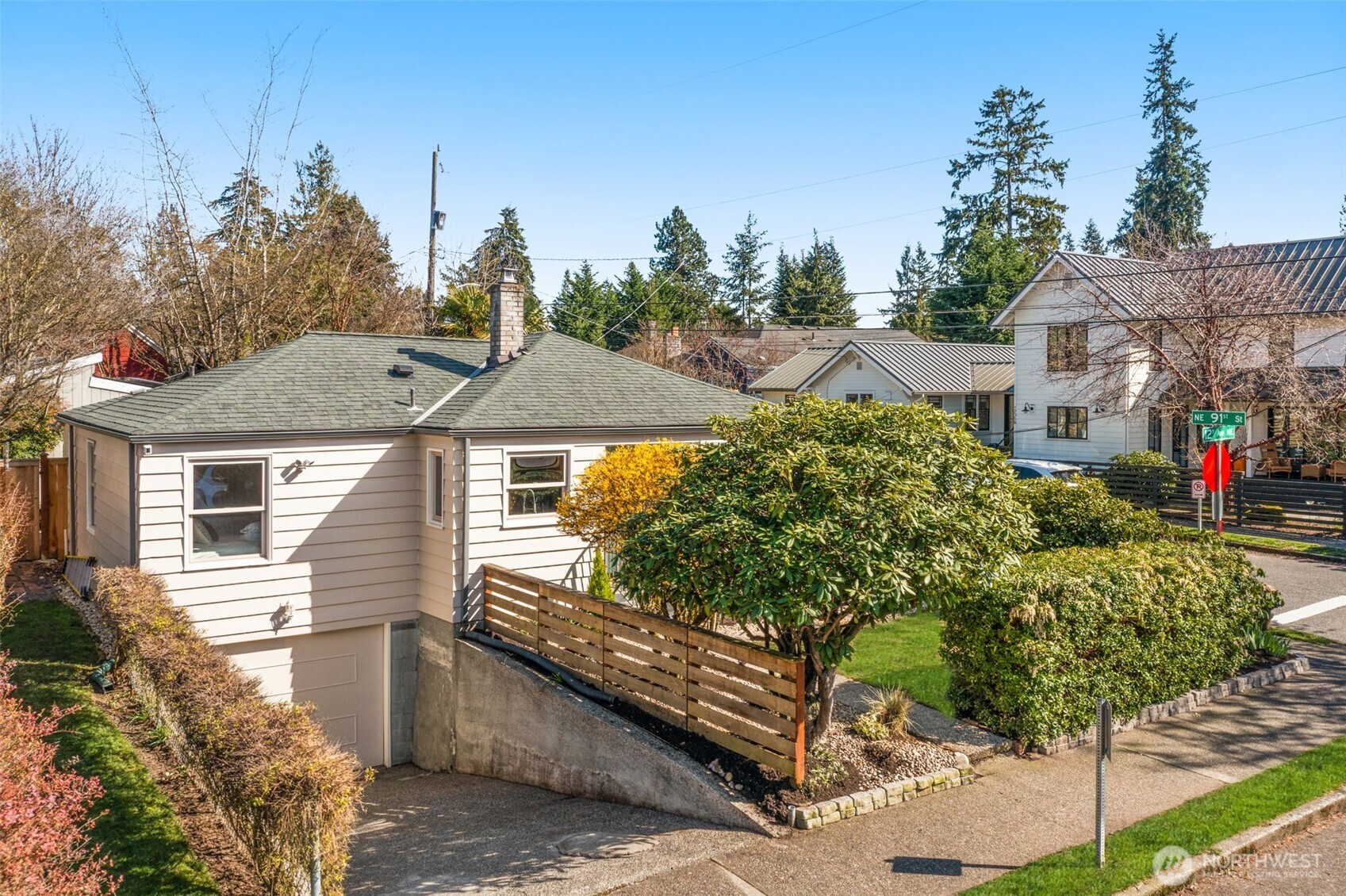 9102 12th Avenue Northeast Seattle, WA 98115 - Photo 30 of 33 a front view of a house with a yard