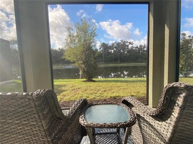 a view of a balcony with chair and table