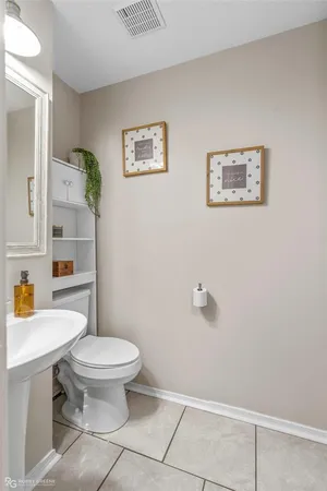 a bathroom with a toilet and a sink