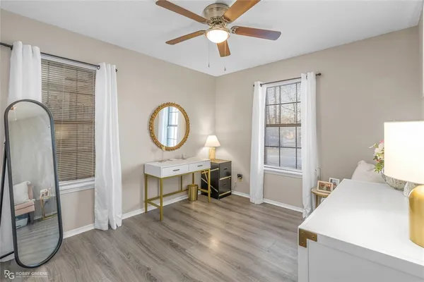 a view of a dining room with furniture a chandelier and wooden floor