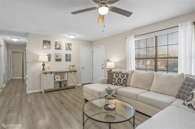a living room with furniture and a large window