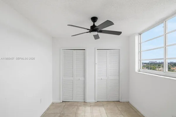 a view of a hallway with a window