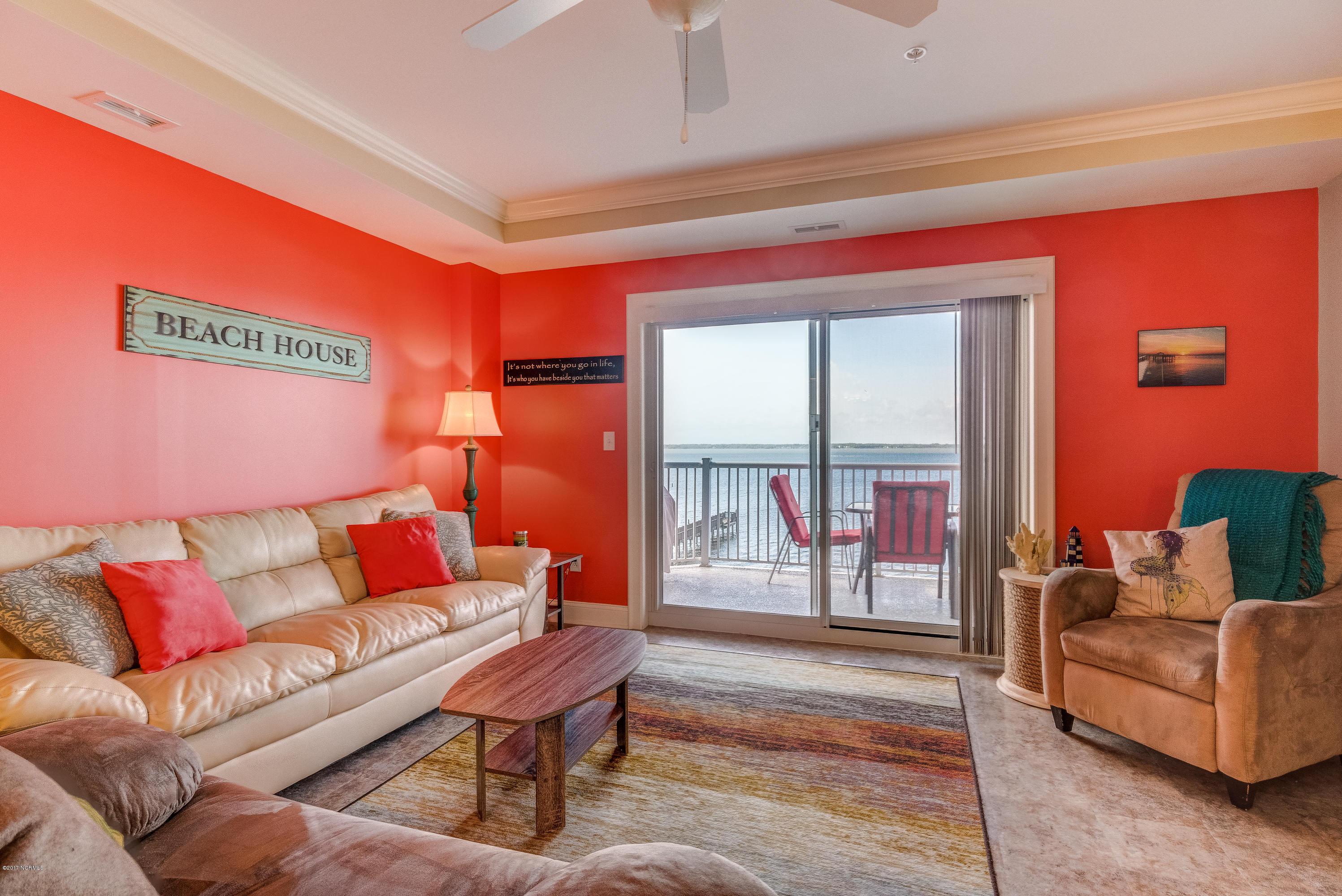 1550 Salter Path Road, Unit 206 Atlantic Beach, NC 28512 - Photo 11 of 38 Comfortable seating for all with walk out to the covered deck.