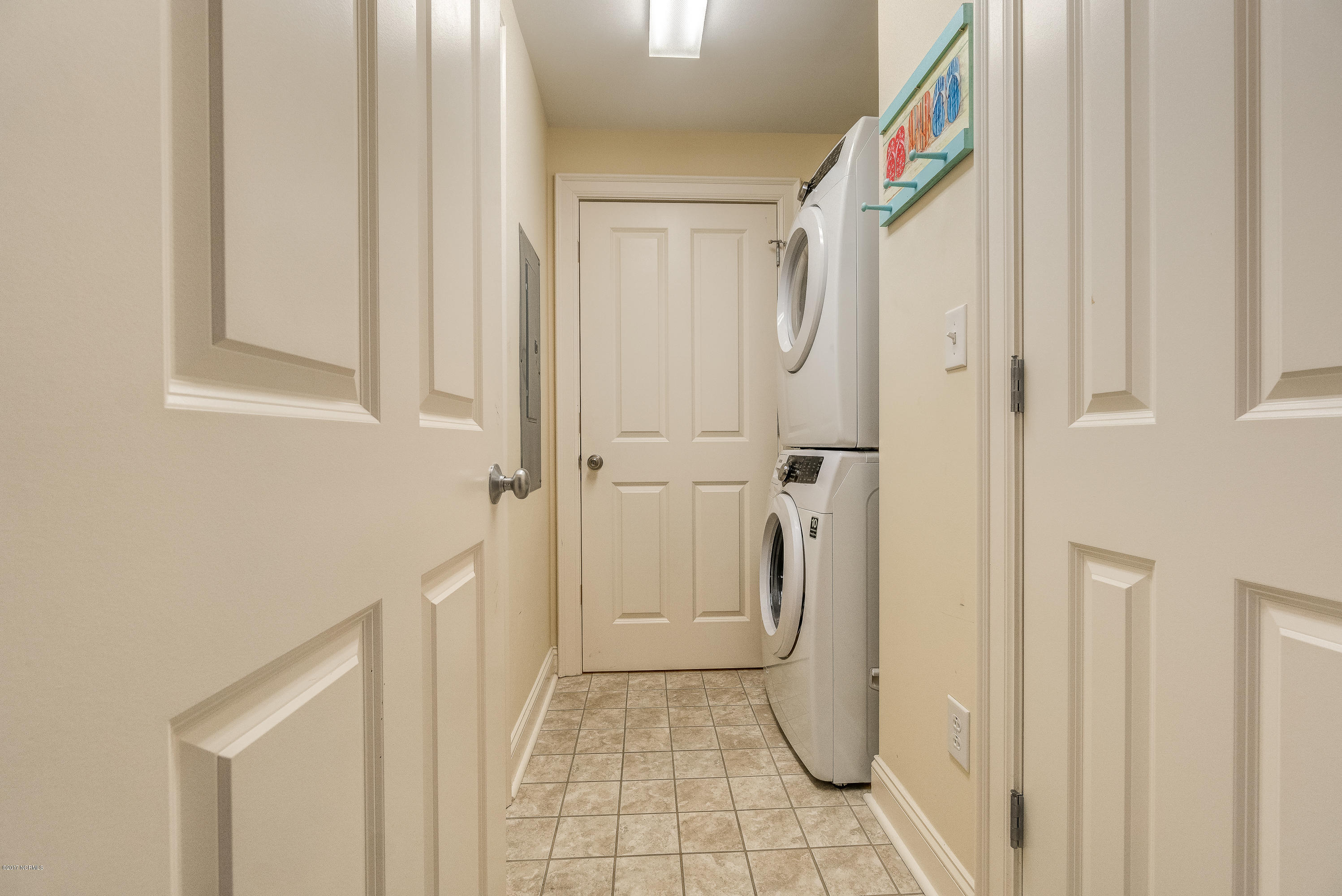 1550 Salter Path Road, Unit 206 Atlantic Beach, NC 28512 - Photo 26 of 38 Enclosed laundry room is off kitchen. Large storage room is here as well.