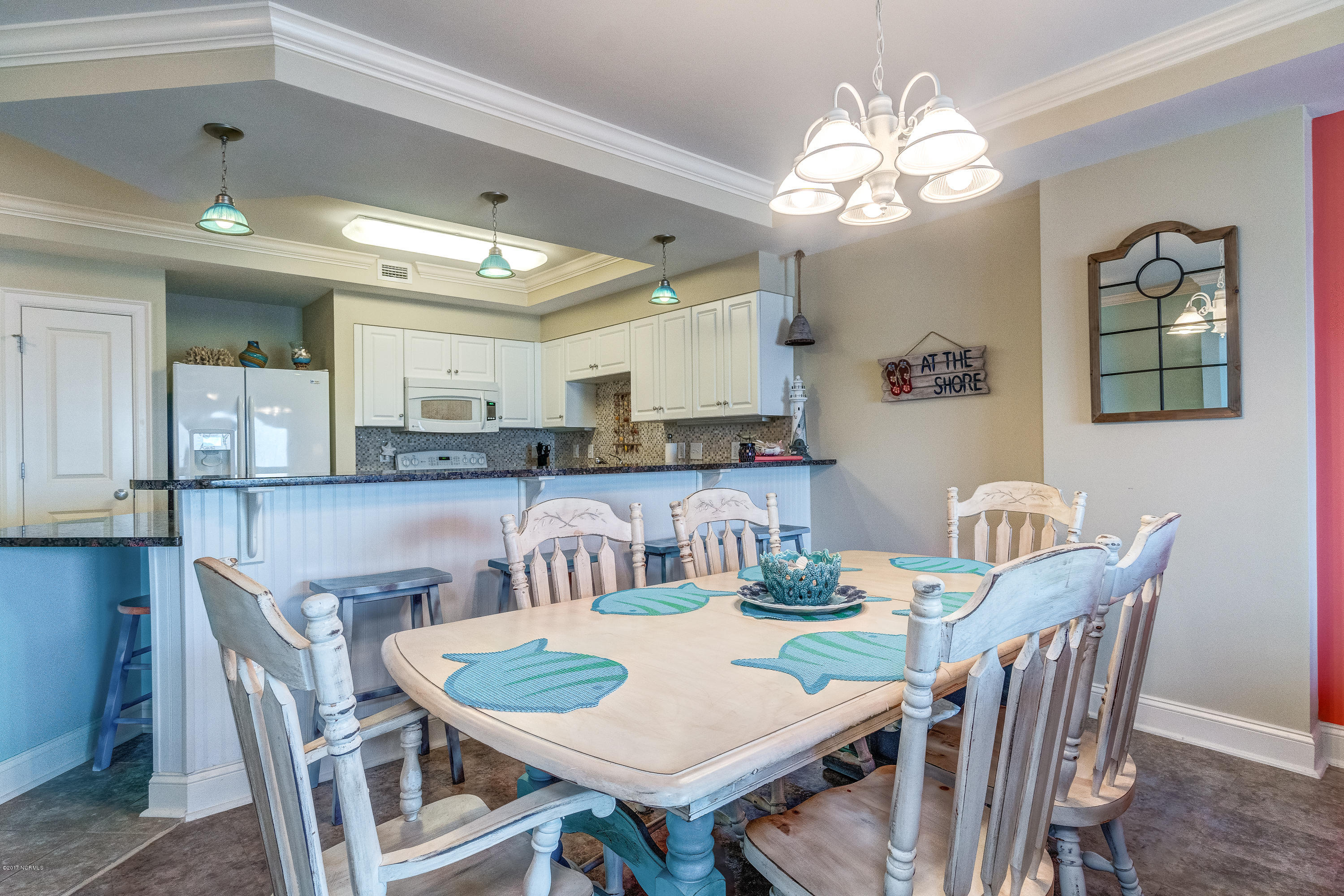 1550 Salter Path Road, Unit 206 Atlantic Beach, NC 28512 - Photo 5 of 38 Table comfortably seats six with more seating at the kitchen bar