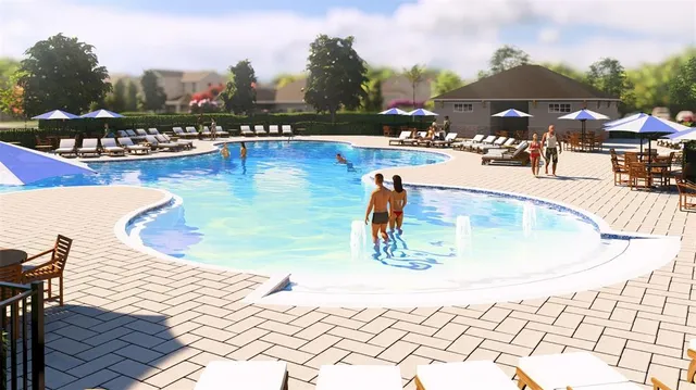 a view of a swimming pool with an outdoor seating