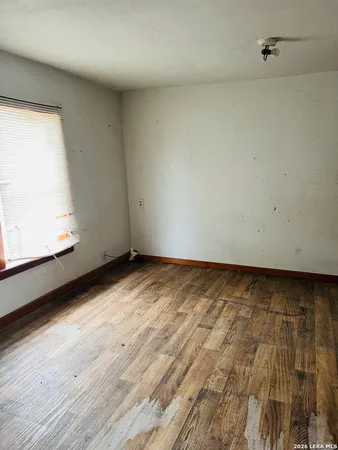 a view of an empty room and window