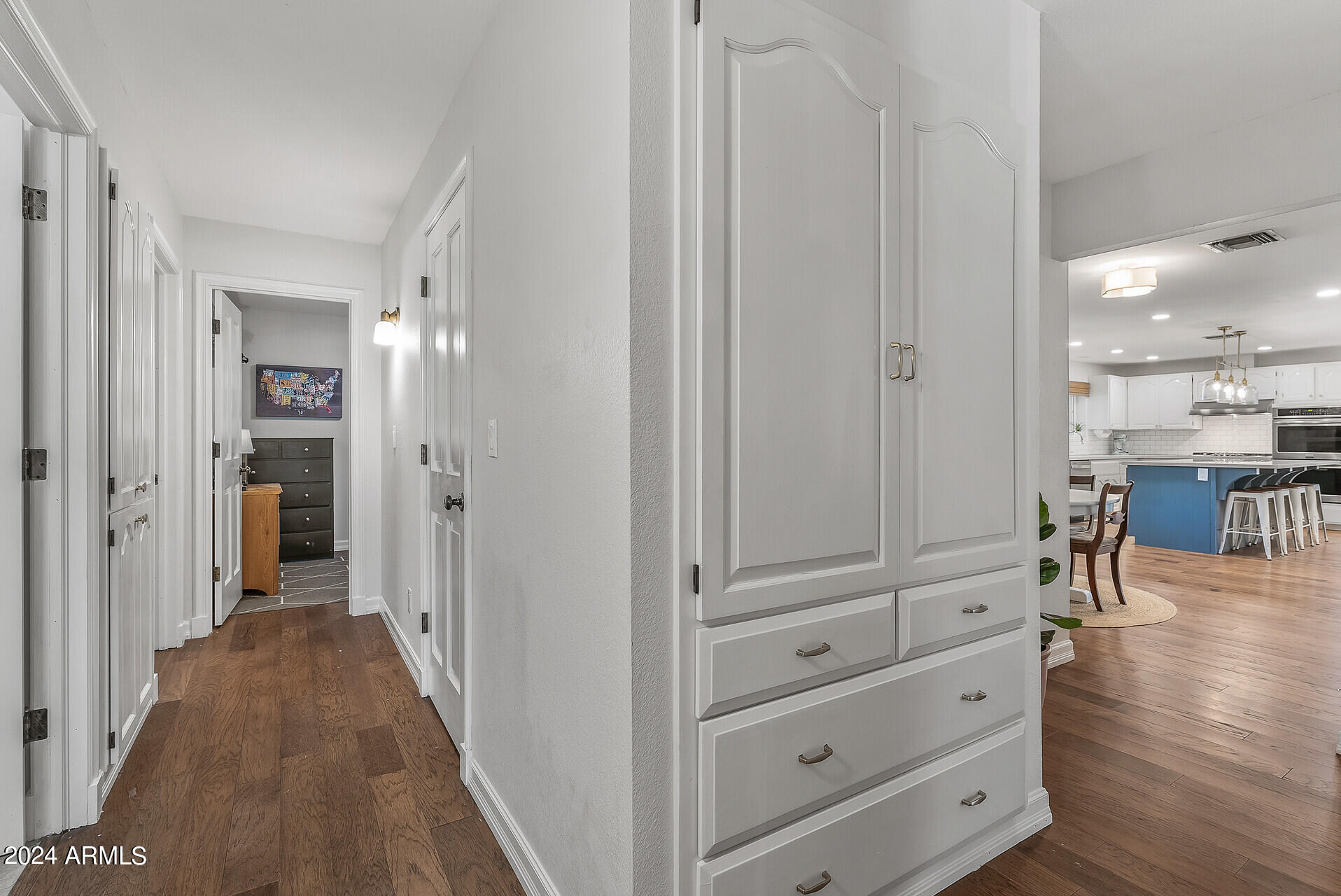 5402 West Piedmont Road Laveen, AZ 85339 - Photo 54 of 95 a view of a hallway with wooden floor windows and a livingroom view