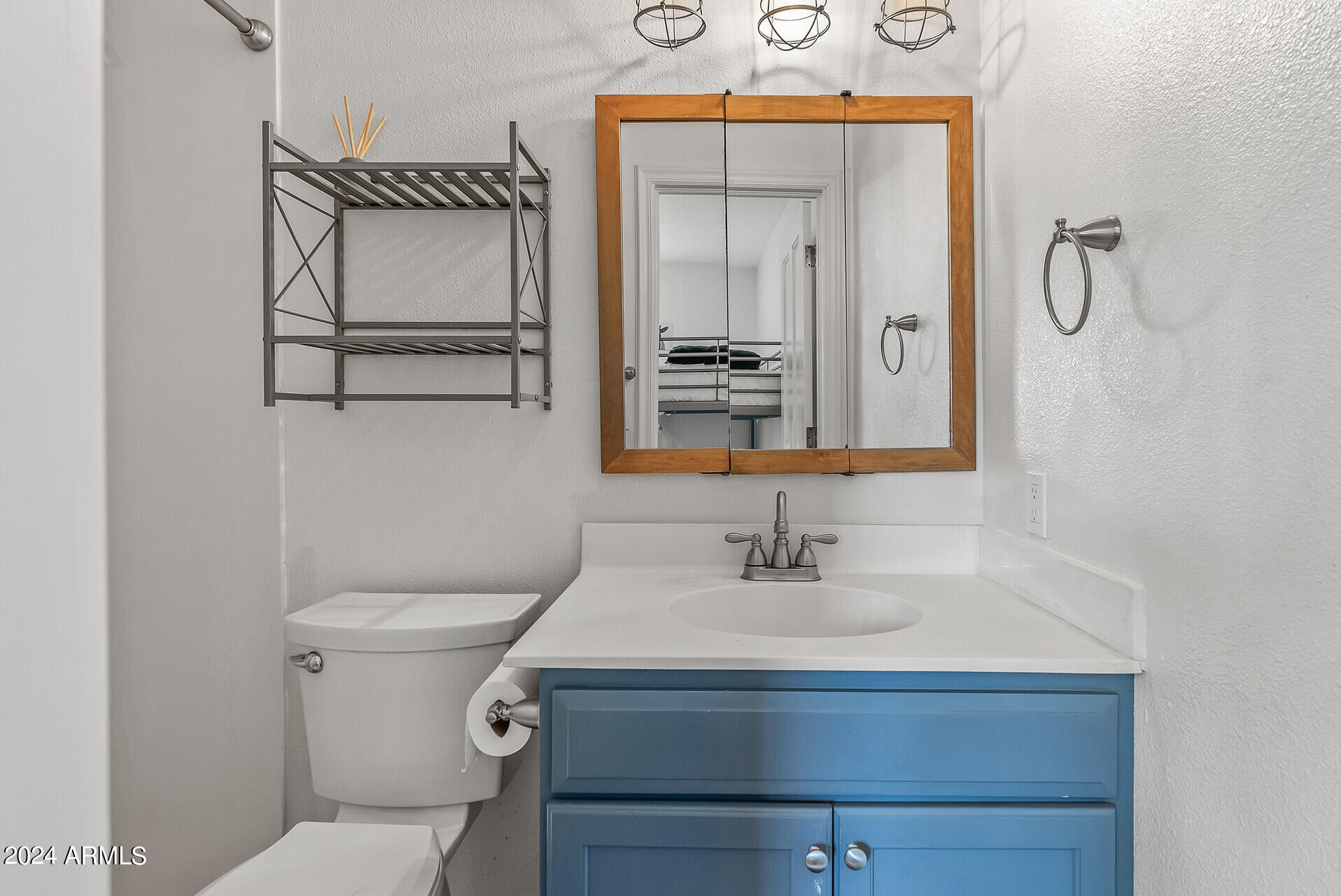 5402 West Piedmont Road Laveen, AZ 85339 - Photo 58 of 95 a bathroom with a sink a toilet and mirror
