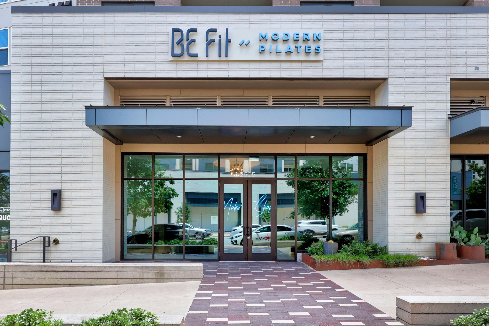 4515 Unity Circle Austin, TX 78731 - Photo 33 of 37 An inviting storefront entrance with a paved walkway and clean brick exterior detailing.