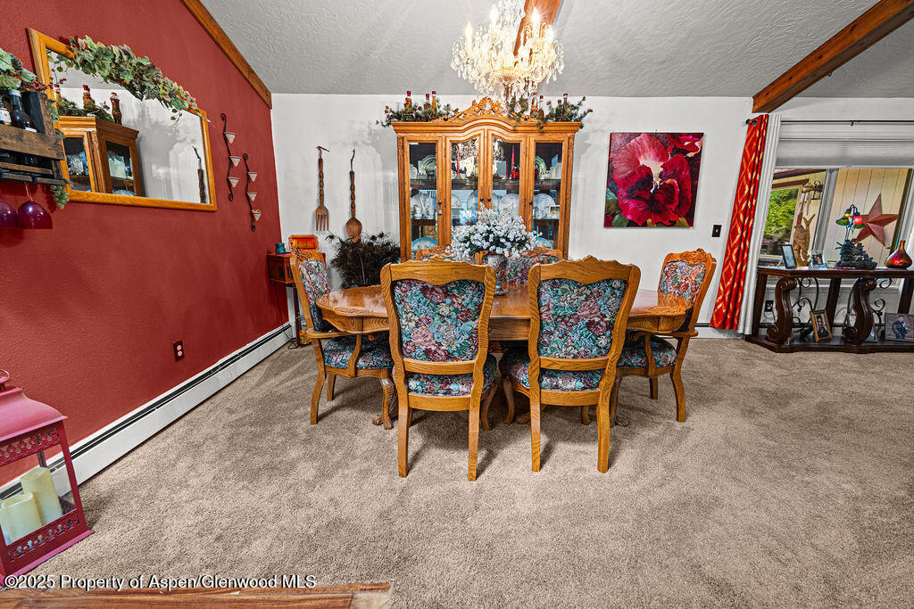 2928 Pinon Circle Craig, CO 81625 - Photo 19 of 92 a view of a dining room with furniture and chandelier