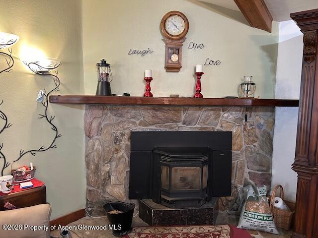 2928 Pinon Circle Craig, CO 81625 - Photo 27 of 92 a living room with a fireplace and a clock
