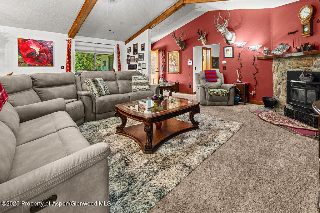 2928 Pinon Circle Craig, CO 81625 - Photo 28 of 92 a living room with furniture a fireplace and a large window