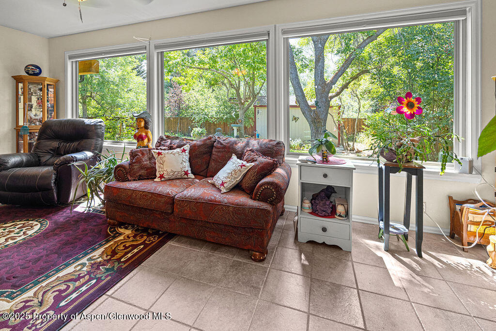 2928 Pinon Circle Craig, CO 81625 - Photo 38 of 92 a living room with furniture and a floor to ceiling window
