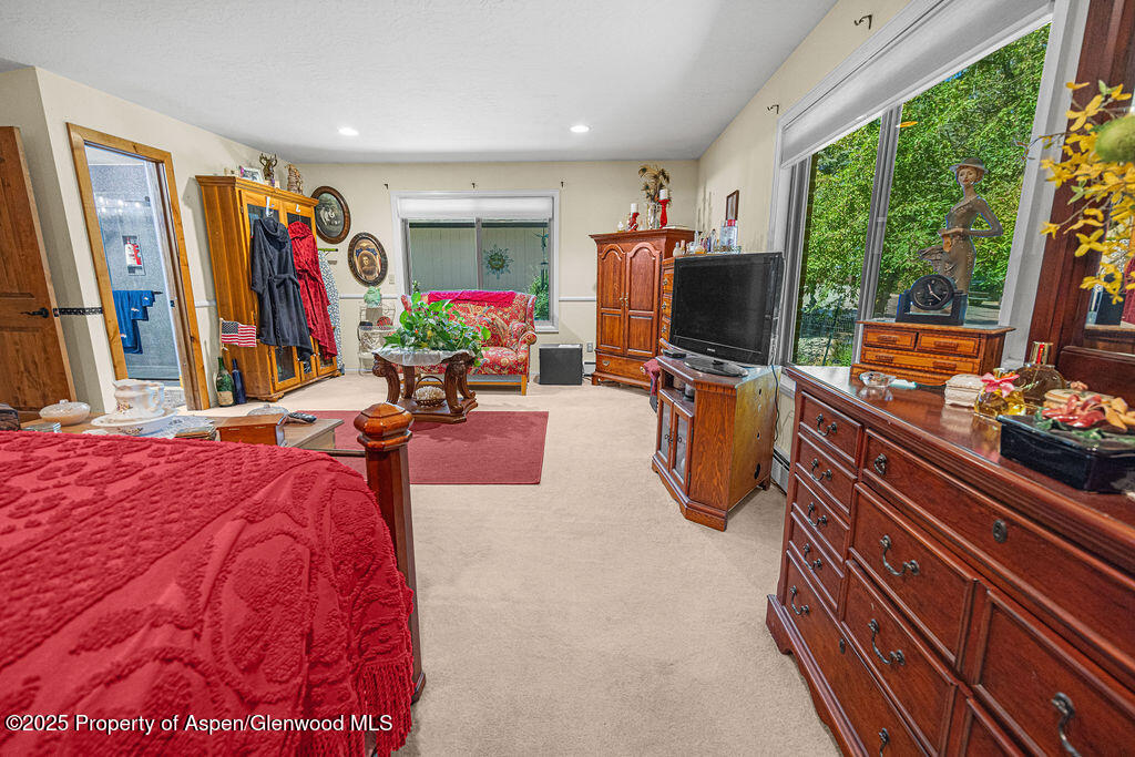 2928 Pinon Circle Craig, CO 81625 - Photo 40 of 92 a living room with furniture a flat screen tv and a large window