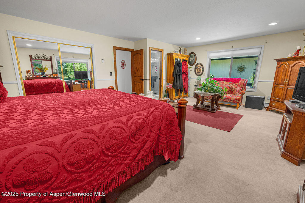 2928 Pinon Circle Craig, CO 81625 - Photo 42 of 92 a bedroom with a bed closet and a large window