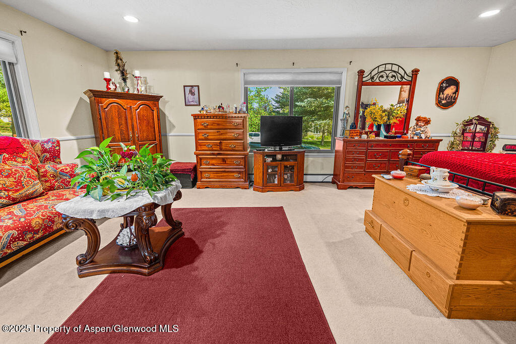 2928 Pinon Circle Craig, CO 81625 - Photo 44 of 92 a living room filled with furniture and a flat screen tv