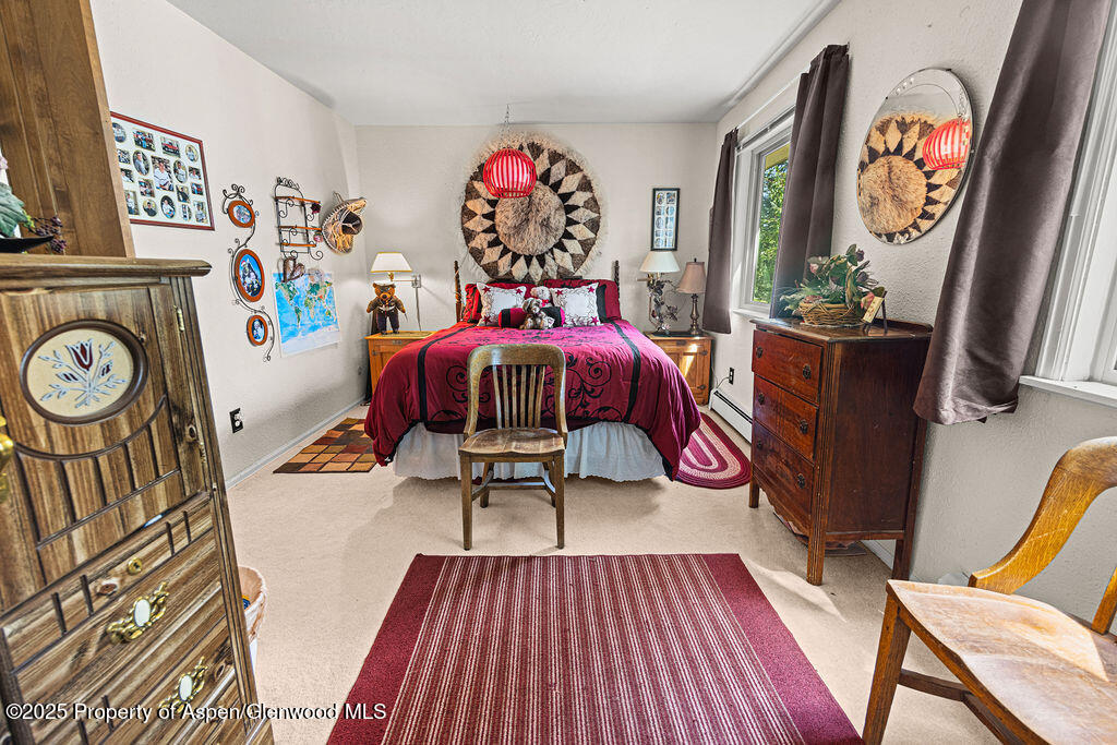 2928 Pinon Circle Craig, CO 81625 - Photo 52 of 92 a living room with furniture a rug and a wooden floor