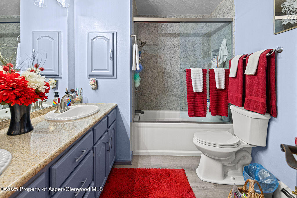 2928 Pinon Circle Craig, CO 81625 - Photo 58 of 92 a bathroom with a granite countertop sink and a mirror