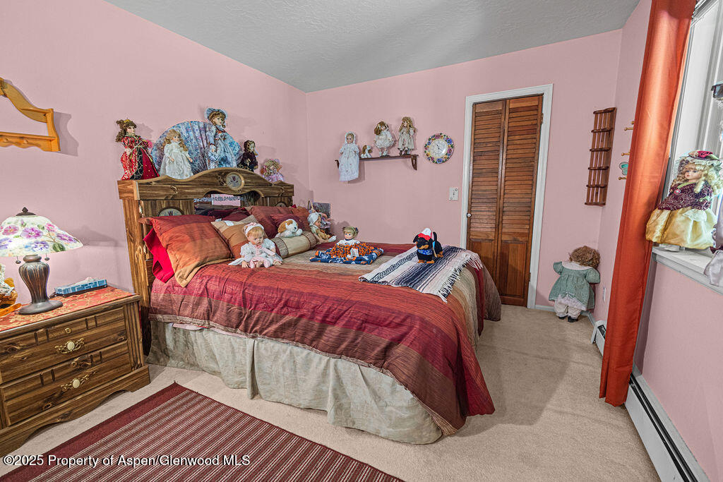 2928 Pinon Circle Craig, CO 81625 - Photo 60 of 92 a bedroom with a bed and a window