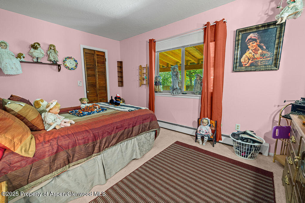 2928 Pinon Circle Craig, CO 81625 - Photo 61 of 92 a bedroom with a bed and a large window