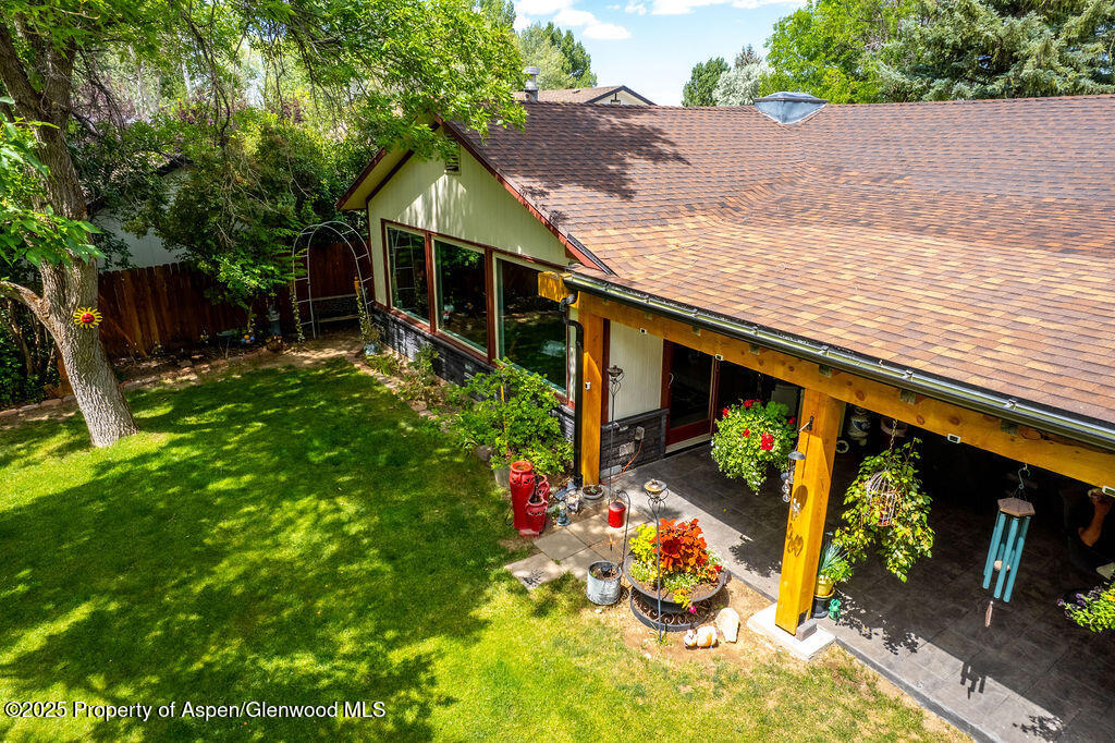 2928 Pinon Circle Craig, CO 81625 - Photo 70 of 92 a view of a chair and tables in the backyard of the house