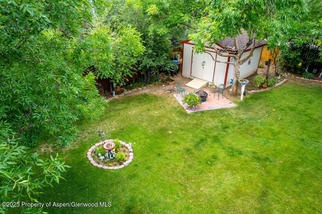 2928 Pinon Circle Craig, CO 81625 - Photo 86 of 92 a view of a house with a big yard and large tree