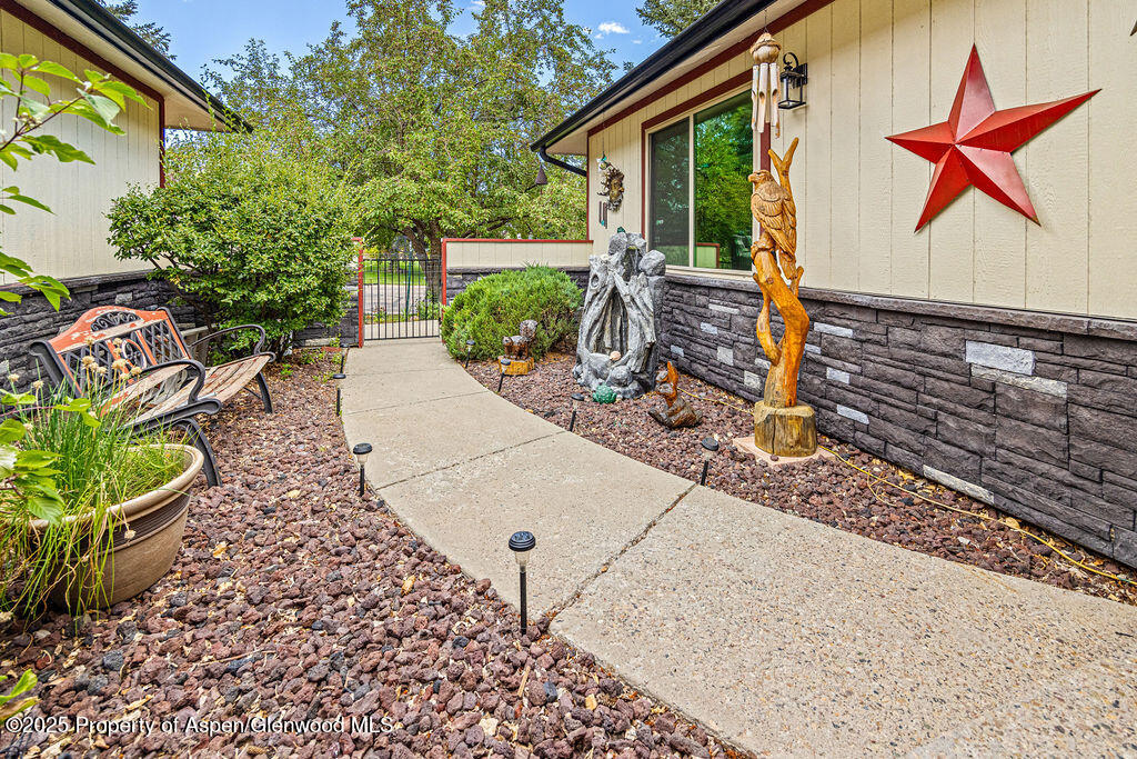2928 Pinon Circle Craig, CO 81625 - Photo 10 of 92 a front view of a house with garden