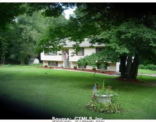 74 Taylor Road Colebrook, CT 06021 - Photo 1 of 1 a view of a house with a backyard