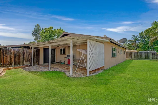 a view of backyard with green space