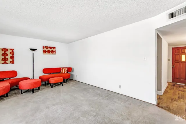 a bedroom with two beds and a window