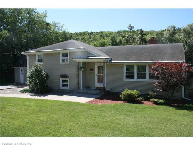 Exterior Front. 8 ROOM SPLIT WITH DETACHED 2-CAR GARAGE.