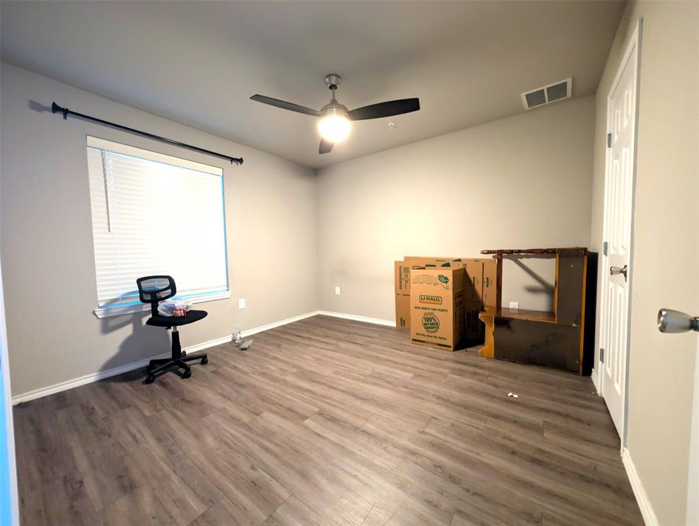 6108 Abrams Road, Unit 202 Dallas, TX 75231 - Photo 3 of 5 a living room with a couch and a chandelier