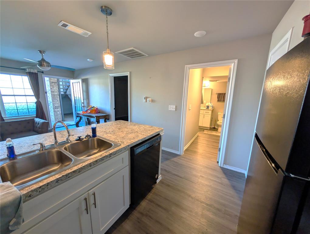 6108 Abrams Road, Unit 202 Dallas, TX 75231 - Photo 5 of 5 a kitchen with sink and refrigerator