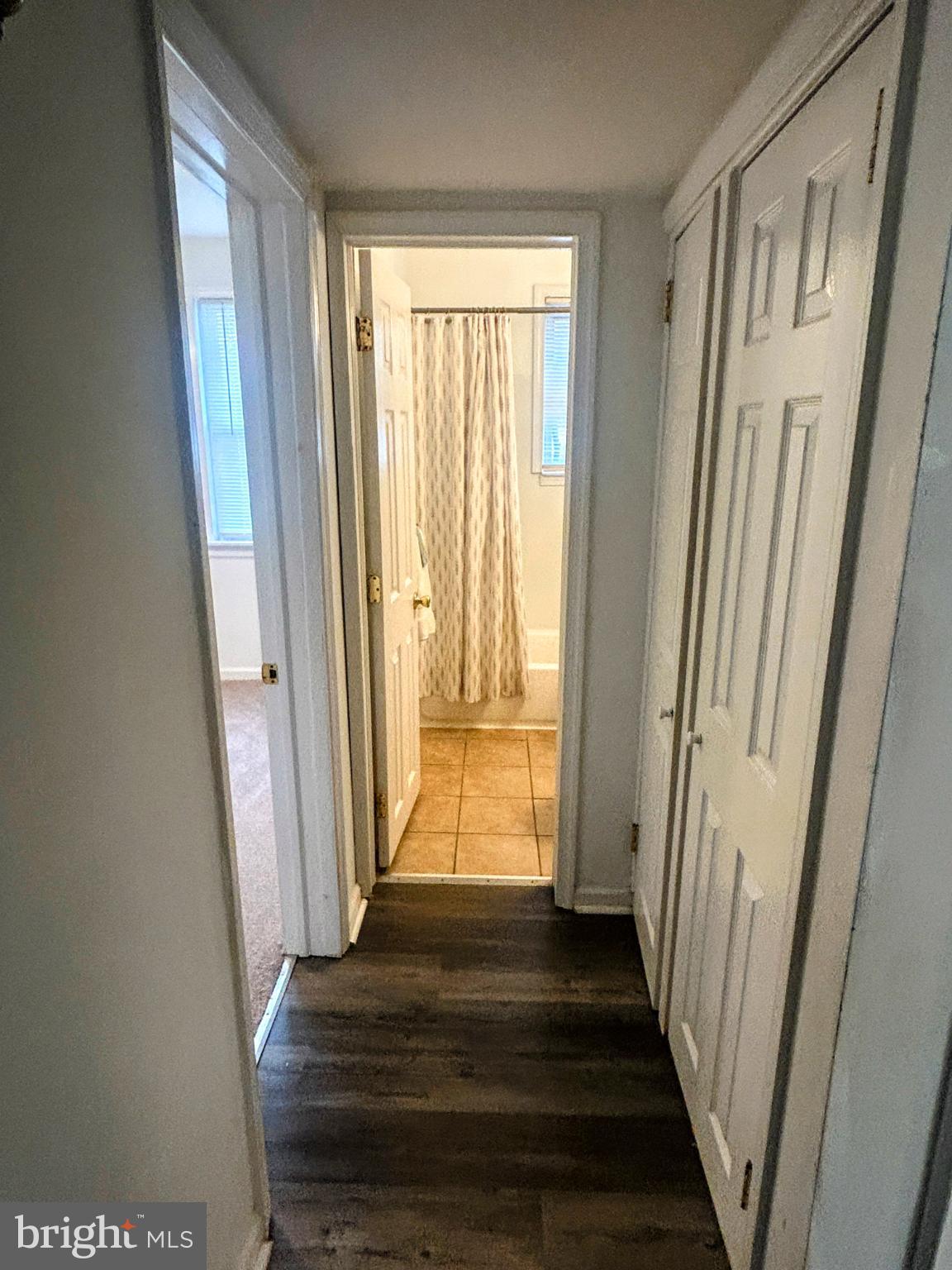 787 Pennsylvania Avenue Wallingford, PA 19086 - Photo 18 of 26 a view of a hallway with wooden floor and stairs