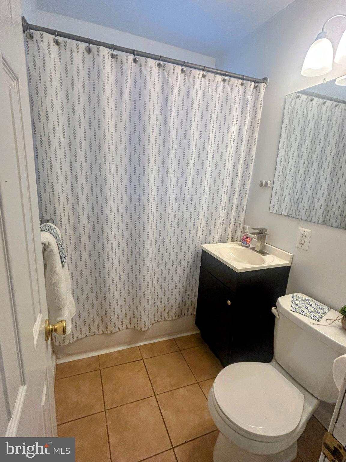 787 Pennsylvania Avenue Wallingford, PA 19086 - Photo 19 of 26 a bathroom with a sink a toilet and shower